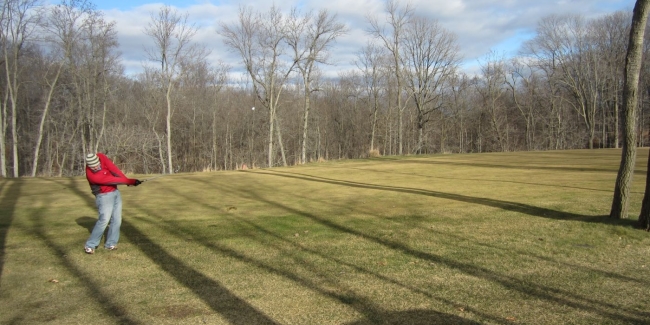 My buddy Adam launches a mid iron into the green at The Bull. (Yes, that is the ball just off his club)